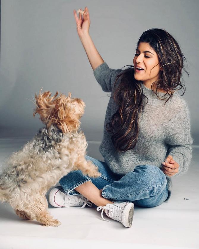 The singing sensation loves dogs and has two pets names Skai and Snoppy and always spends time with them.
In picture: Ananya Birla enjoys being a pet mother as she gets playful with her dog Skai.