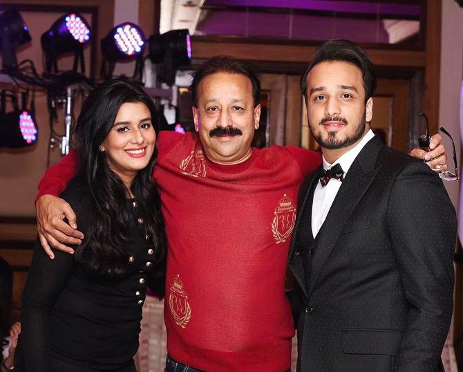 Zeeshan Siddique, who recently turned 27 this month, describes himself on Instagram as the '1st General Secretary of the Mumbai Pradesh Youth Congress' and a person who has a 'Masters in Global Management & Public Leadership'.
In picture: Zeeshan Siddique poses for a picture with his father Baba and sister Arshia Siddique.