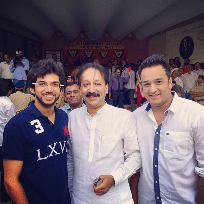 In picture: Zeeshan Siddique poses for a picture with his father Baba Siddique and Yuva Sena chief Aaditya Thackeray as the two attend Shiv Sena chief Uddhav Thackeray's photo exhibition at Jehangir Art gallery in South Mumbai.