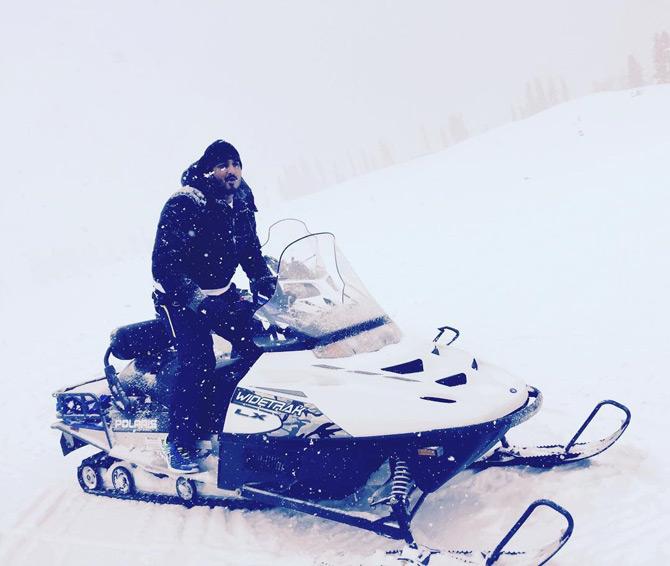 In picture: Zeeshan Siddique enjoys riding a snowmobile in Gulmarg Kashmir.