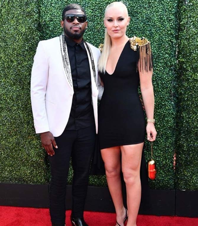 While Lindsey Vonn dazzled in a short black dress at the MTV awards, her fiance wore a black shirt and trousers with a white coat.