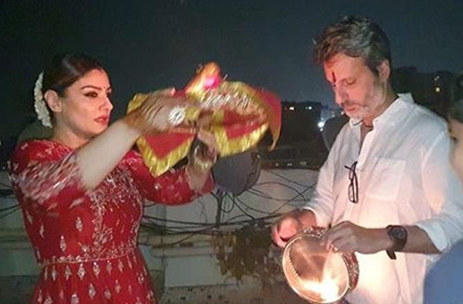 Raveena Tandon: The actress shared a series of pictures, where she was performing the Karwa Chauth ritual with husband Anil Thadani. 