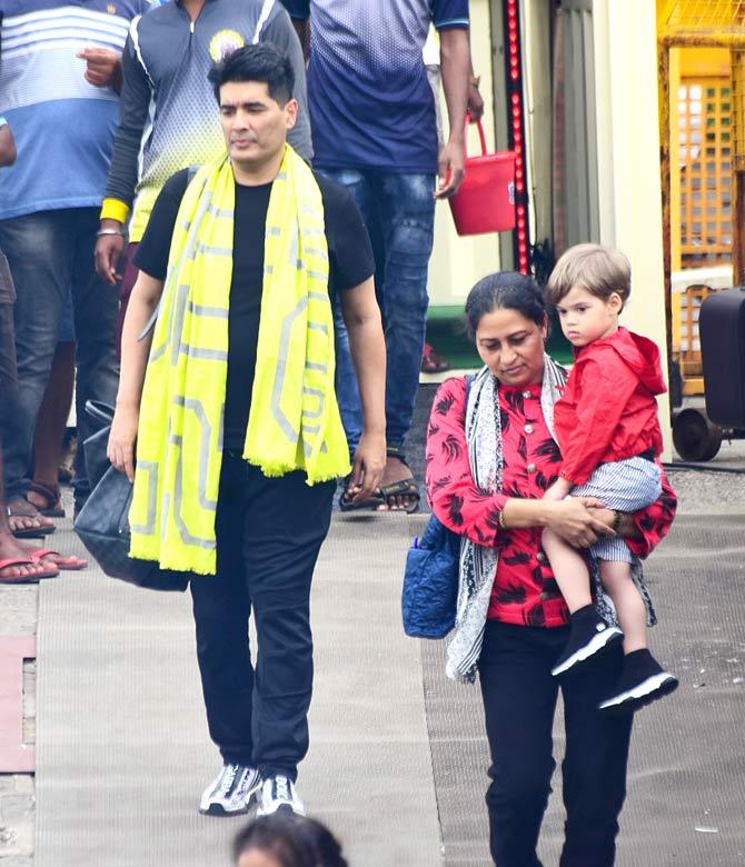 Manish Malhotra was also clicked with the party heading to Alibaug. Karan Johar's son, Yash, was being carried by his nanny. The little one was super cute in a red hoodie and grey shorts.