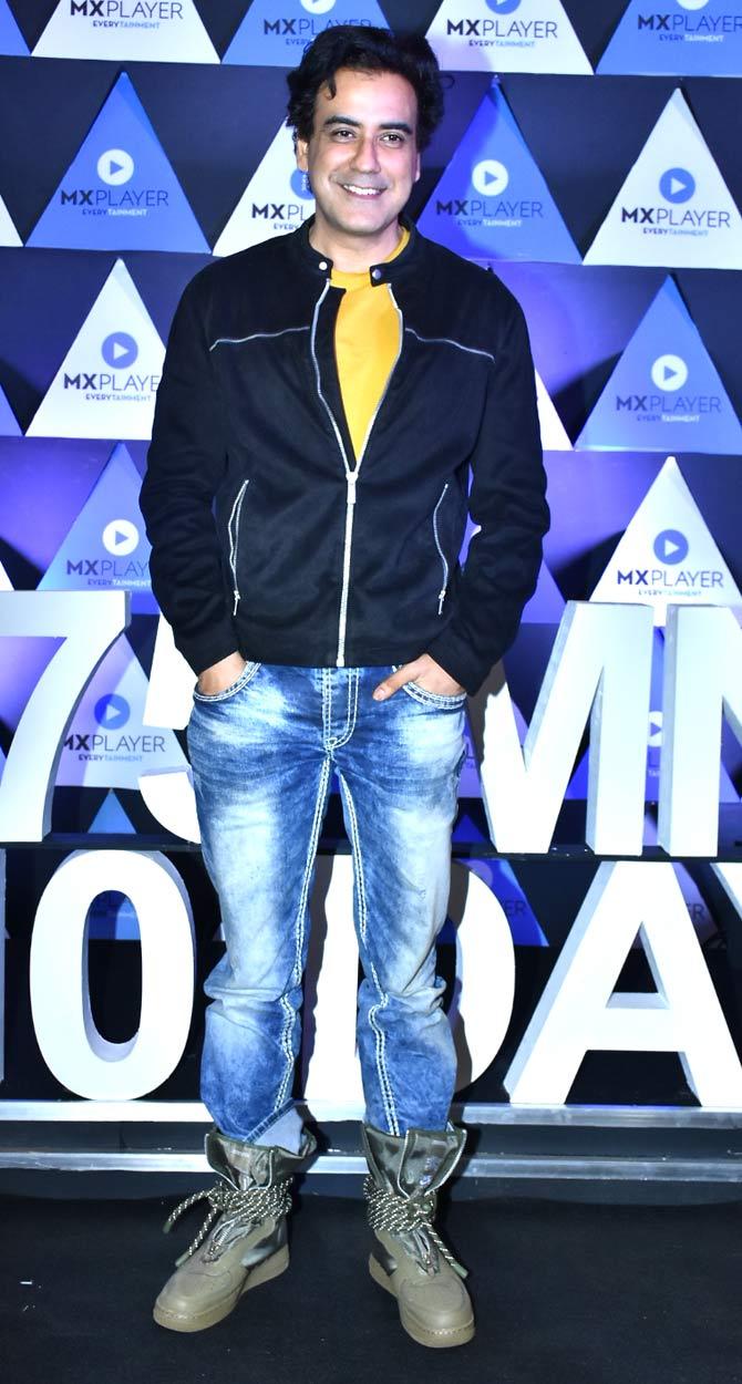 Karan Oberoi opted for a yellow t-shirt, black jacket, denim and funky grey long boots.