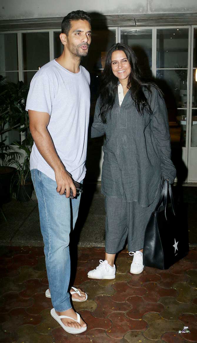 Angad Bedi and his wife Neha Dhupia were spotted hanging out together. For the outing, Neha opted for a grey oversized t-shirt and trousers, while the Soorma actor donned a grey t-shirt and denim.