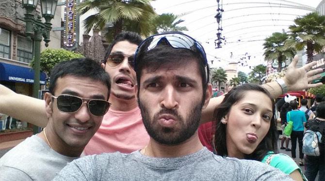 Abhishek Nayar captioned this selfie: Funfilled day wid family @ universal studio after a long day time to get out again& enjoy da singapore nightlife