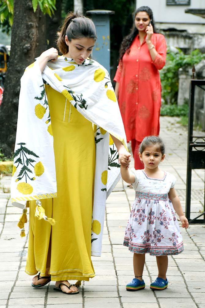 Soha Ali Khan and Kunal Kemmu were clicked with their tiny tot Inaaya Naumi Kemmu in Bandra, Mumbai. While Soha opted for ethnic wear, Inaaya looked as cute as a button in a baby frock. All pictures/Yogen Shah