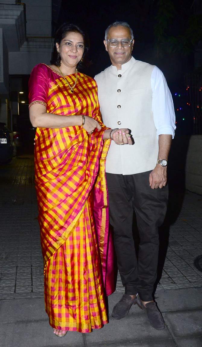 Priya Dutt was also clicked with husband Owen Roncon at Pradeep Guha's Diwali bash. Priya Dutt looked lovely in a pink and orange checked sari.