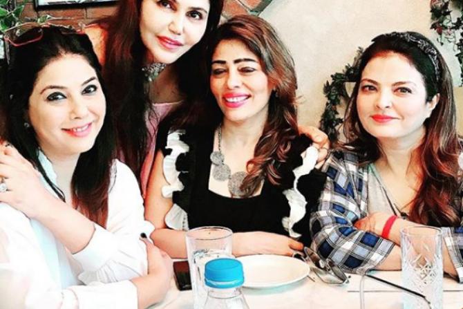 Jamvwal was seen in a dress which had a plain pink crop top over it. The dress was floral-printed with a black base and she accessorised it with a necklace and a hairband.