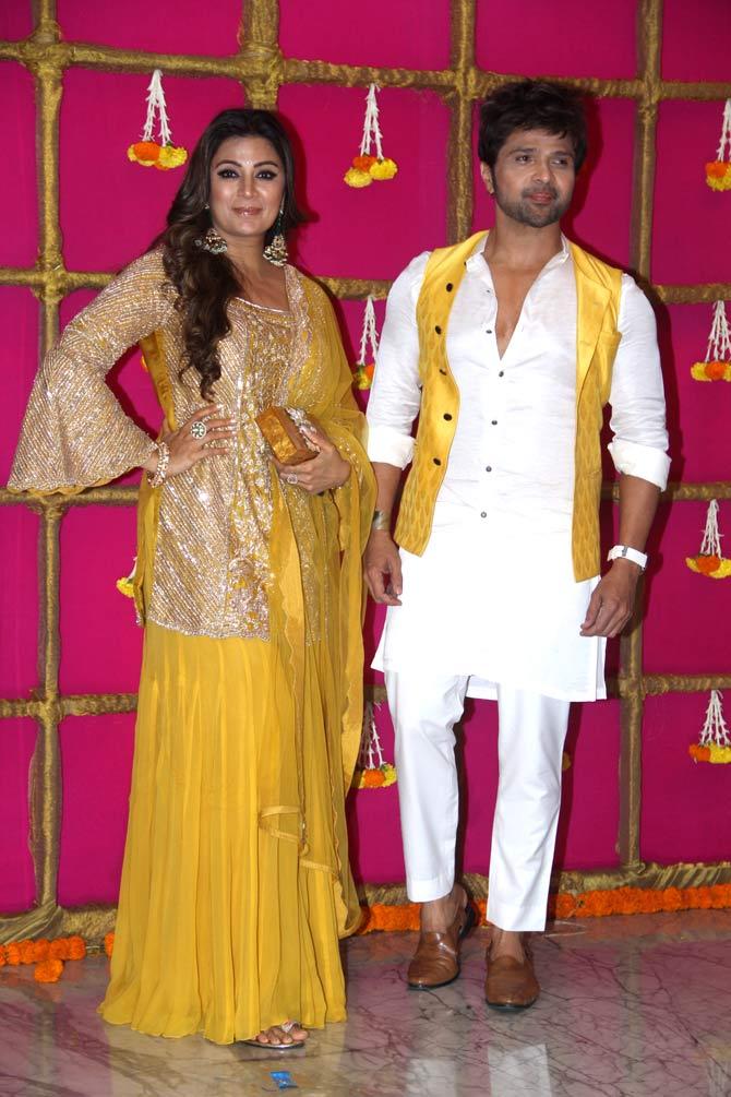 Himesh Reshammiya was twinning with wife Sonia Kapoor at the lavish Diwali bash. While Sonia chose a yellow sharara set, Himesh wore a white kurta-pyjama and sleeveless yellow jacket.