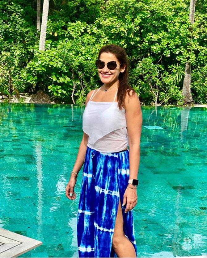 In a white top and blue skirt, Karachiwala looks all-ready for a photo!