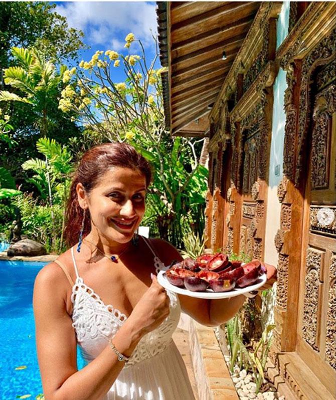 At her Bali vacation, Karachiwala posed with a fruit she gorged upon during the vacations. She wrote, 