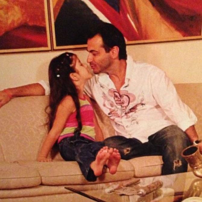 Sanjay Kapoor gives his sweet little baby girl a kiss! Shanaya has always been close to her parents and her brother, and frequently goes on vacations with her family. Sanjay and Maheep share tons of pictures of their family from beautiful locales, giving us major vacation goals! 