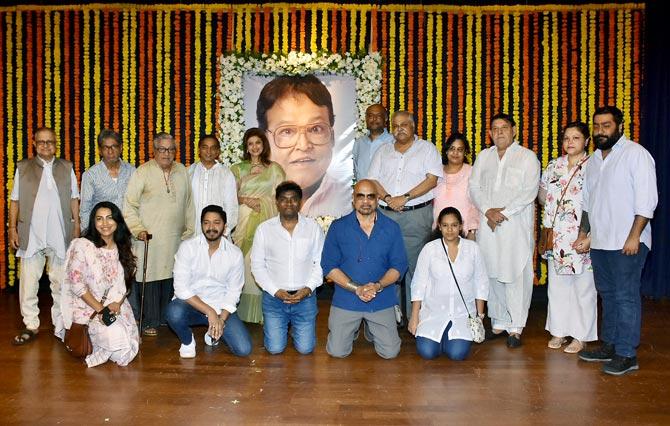 Viju Khote's friends and family posed with his portrait at the prayer meet in Dadar, Mumbai. 