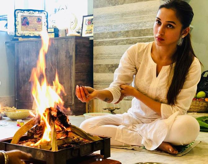 Donning a traditional white salwar kurta, Mimi Chakraborty was seen performing Puja at her residence marking the beginning of Durg Puja. In picture, Mimi Chakraborty performs puja at her residence in Kolkata