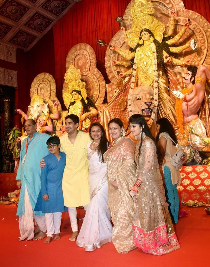 Rani Mukerji was seen posing with Ayan Mukerji, Deb Mukherjee, Sharbani Mukherjee and other guest at the Durga Puja Pandal in Juhu.