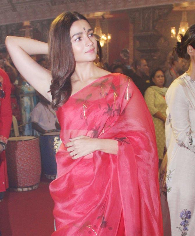 Alia Bhatt looked pretty in her paper-silk red saree as she came in to seek blessing at North Bombay Sarbojanin Durga Puja Samiti in Juhu.