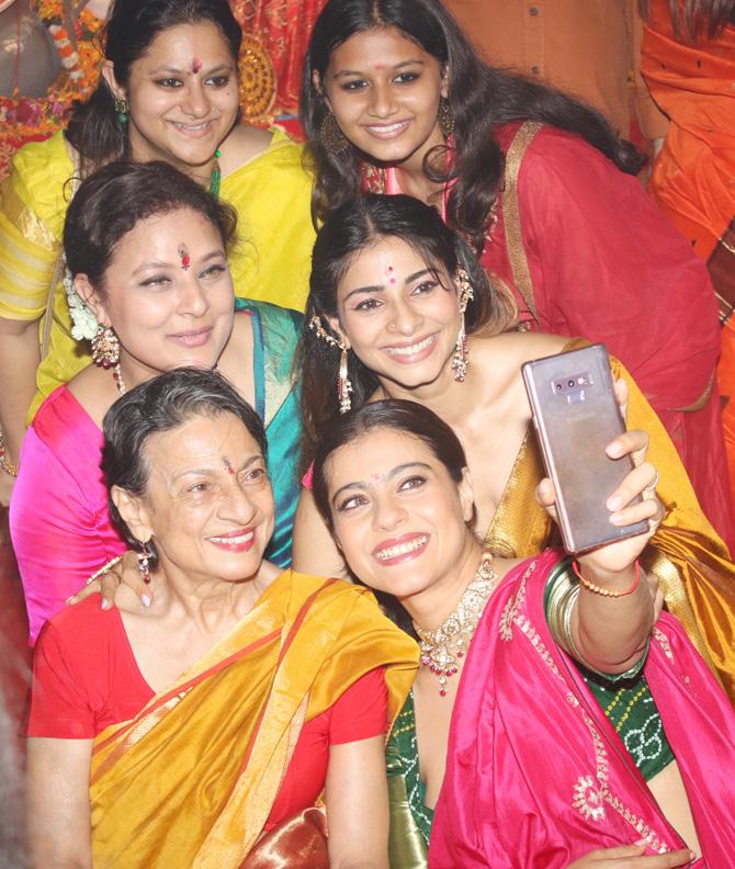 Kajol along with mother Tanuja and sister Tanishaa too have been attending the festivities for last few days at the Durga Puja Pandal in Juhu. Kajol has been posting pictures from the festivities on her Instagram account.
In picture: Kajol takes a selfie with Tanuja, Tanishaa, Sharbani and other guests.