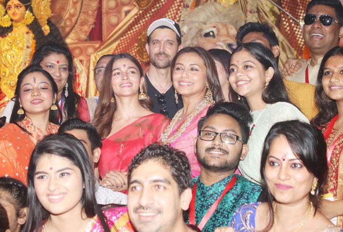 Rani Mukerji, Alia Bhatt, Ayan Mukerji and other guests pose for a group photo at the Durga Puja Pandal in Juhu, Mumbai.