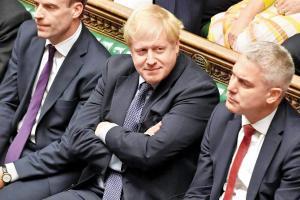Britain's Prime Minister Boris Johnson (centre) listening to a debate on the Brexit deal in the House of Commons in London. Pic/AFP