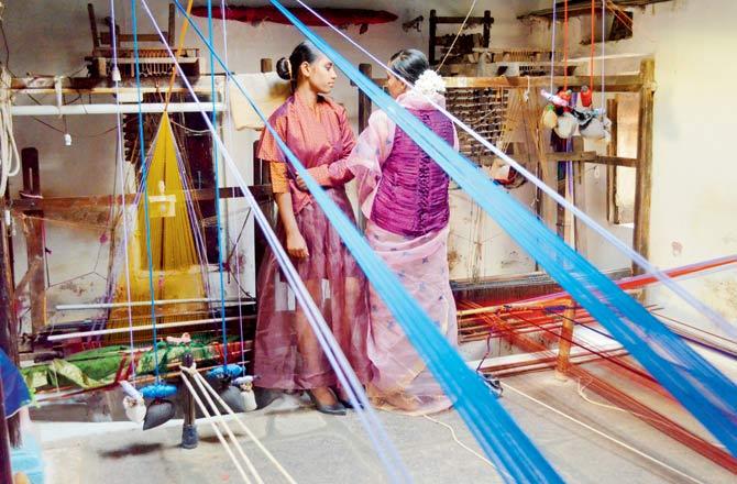 Pit looms in the homes of Guledgudda weavers where local women pose in khunn blouses designed by Vaishali Shadangule. Typically, khunn used the standard green, yellow, blue and magenta. Now, weavers have expanded their colour palette to include whites, peacock blue and different shades of red