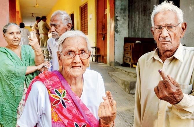Elderly voters after casting their votes in Sonepat. Pic/PTI