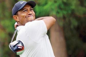 Tiger Woods equals record, has sights on 2020 Olympics