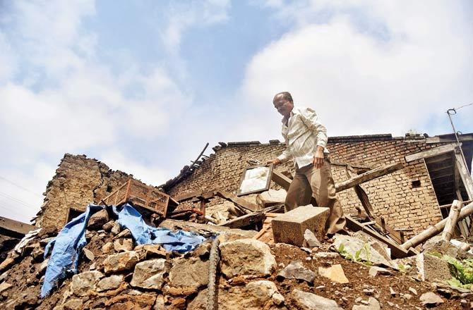 Malgonda Patil whose house was reduced to rubble in the floods in Herwad village