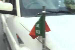 BJP MLA demands action after party flag removed from car at AMU