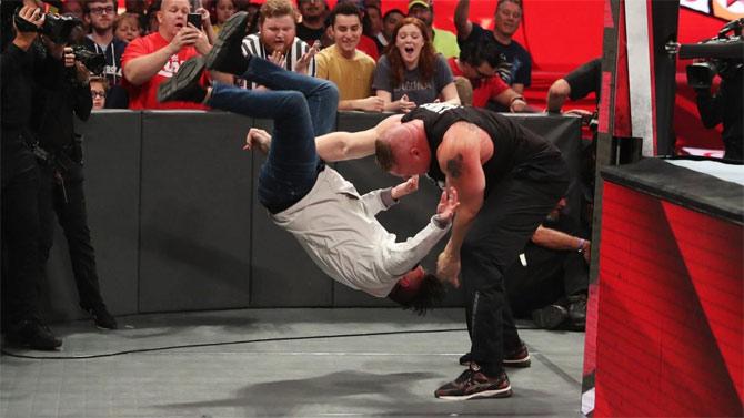 Brock Lesnar attacking Dominik