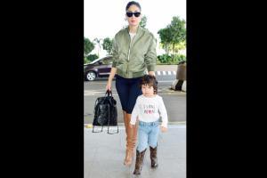 Taimur twins in boots with Kareena at airport; dons 'I Love Mom' tee