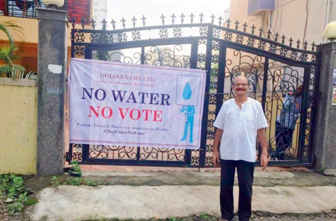 A resident with a NOTA banner put up at the society gates. File pic