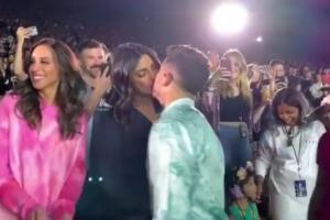 Priyanka and Nick stealing a kiss mid-concert is aww-dorable!