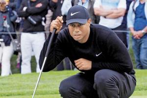 Tiger Woods roars back to take lead after horror start in Japan