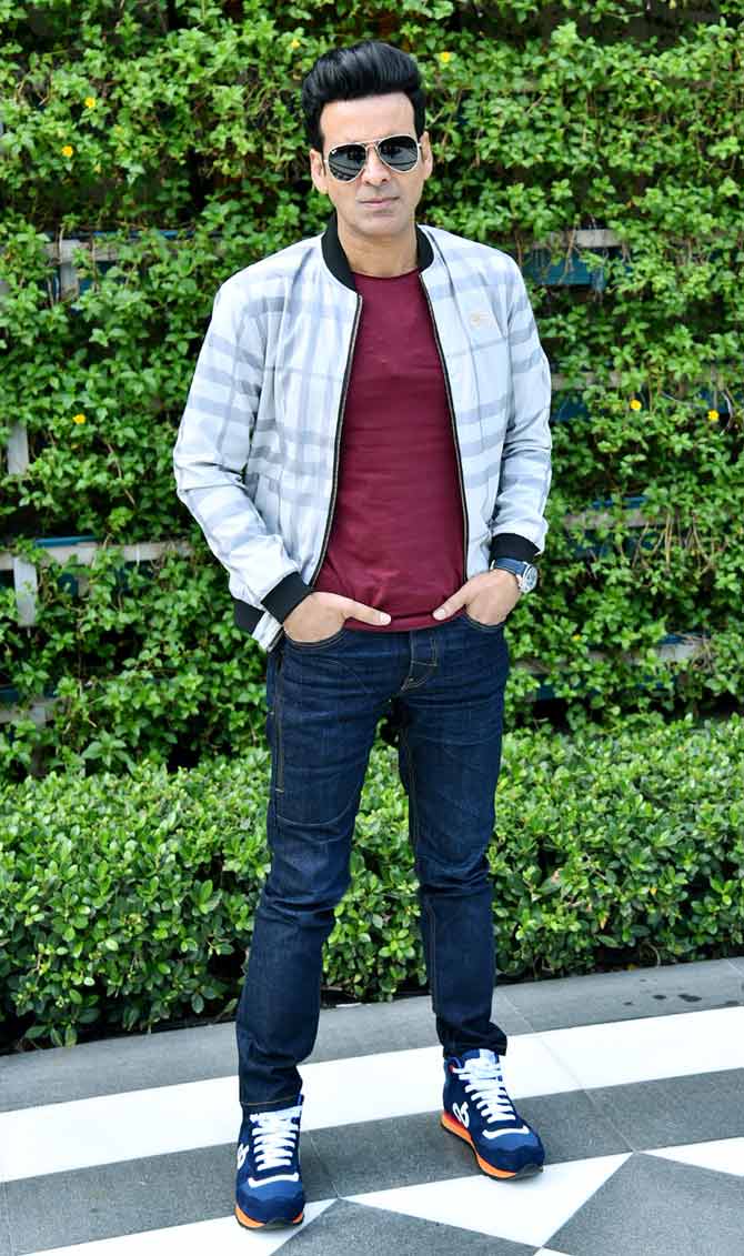The makers of The Family Man were spotted on a promotional event in Delhi. Manoj Bajpayee and Priyamani were snapped at the event. All pictures/Pallav Paliwal.
In picture: Manoj Bajpayee posed for the shutterbugs at the promotional event.