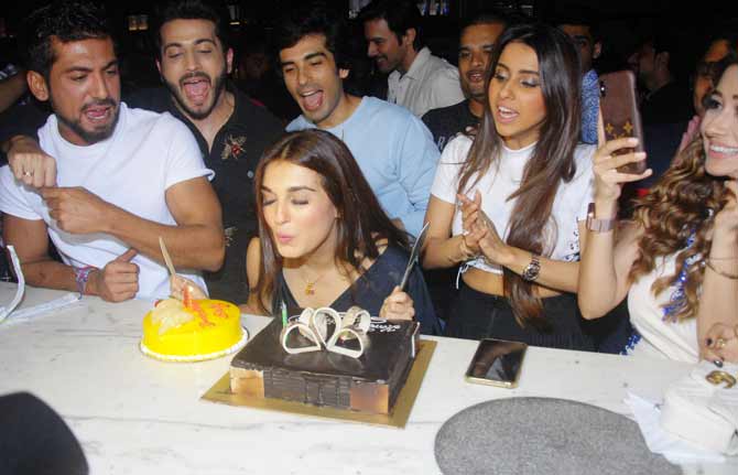 Shiny Doshi seen cutting the cake in midst of her friends at her birthday bash.