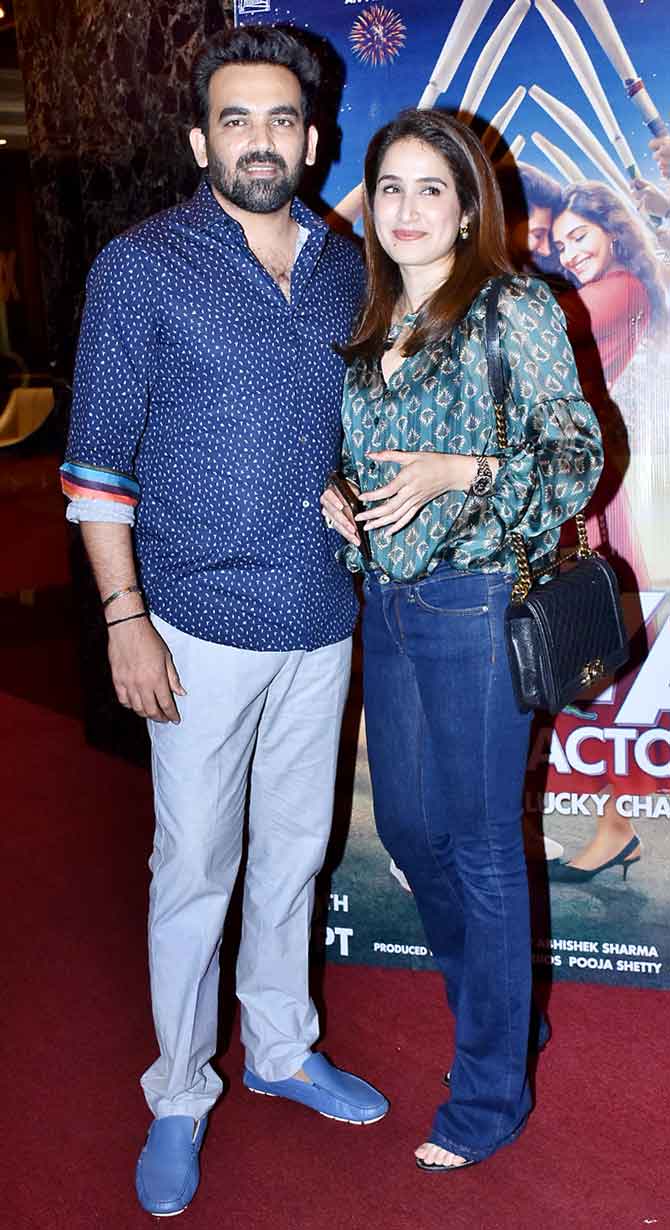 The lovely couple - Zaheer Khan and Sagarika Ghatge - posed for the cameras at the screening of The Zoya Factor at a multiplex in Mumbai. Sagarika looked pretty in a satin printed shirt paired with bootcut jeans.