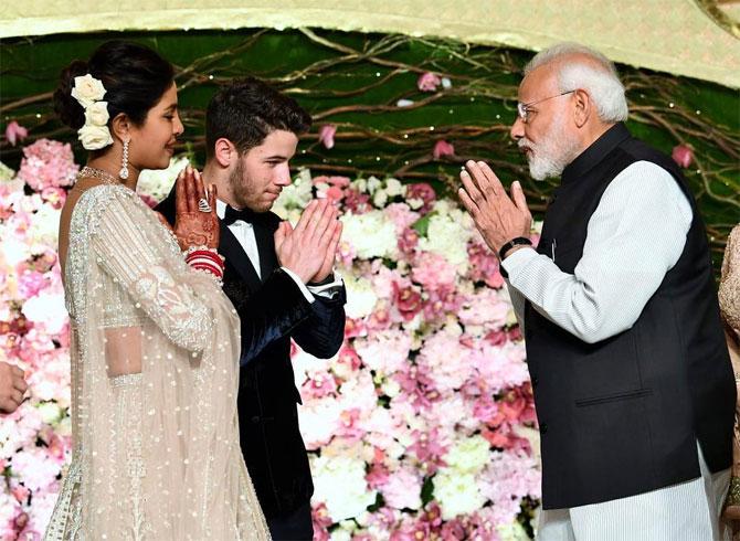 In December 2018, PM Narendra Modi led a crowd in congratulating newly-married couple, actress Priyanka Chopra and American singer Nick Jonas at their wedding reception in New Delhi. PM Modi, who was escorted on stage by Priyanka's mother Madhu Chopra, gifted the newlyweds a rose each and shared some moments of laughter. For the occasion, PM Modi was dressed in a white kurta-pajama with a black Nehru jacket.