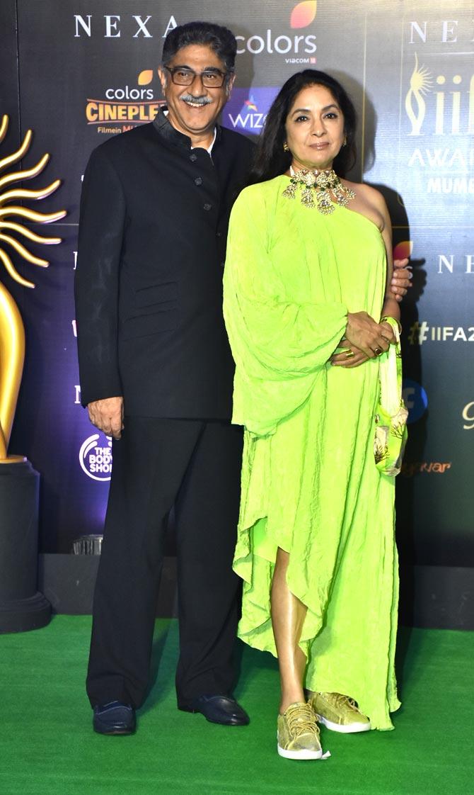 Neena Gupta dazzled in a neon green asymmetrical dress, which she paired with Kundan jewellery and golden sports shoes for the outing. The actress attended the awards ceremony with husband Vivek Mehra.