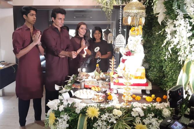 Dressed in burgundy-coloured ethnic wear, Sonu Sood looked handsome with his family. A picture of the family performing the 'aarti' has surfaced online. Sood shared some more pictures on his Instagram account and wrote: 