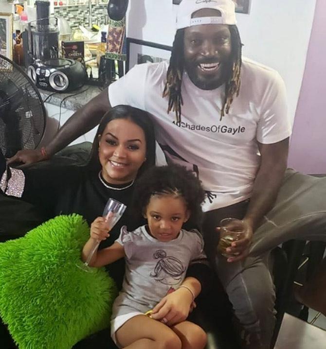 In picture: Gayle with his partner Alyssa and daughter Kris-Allysa celebrating Alyssa's birthday.