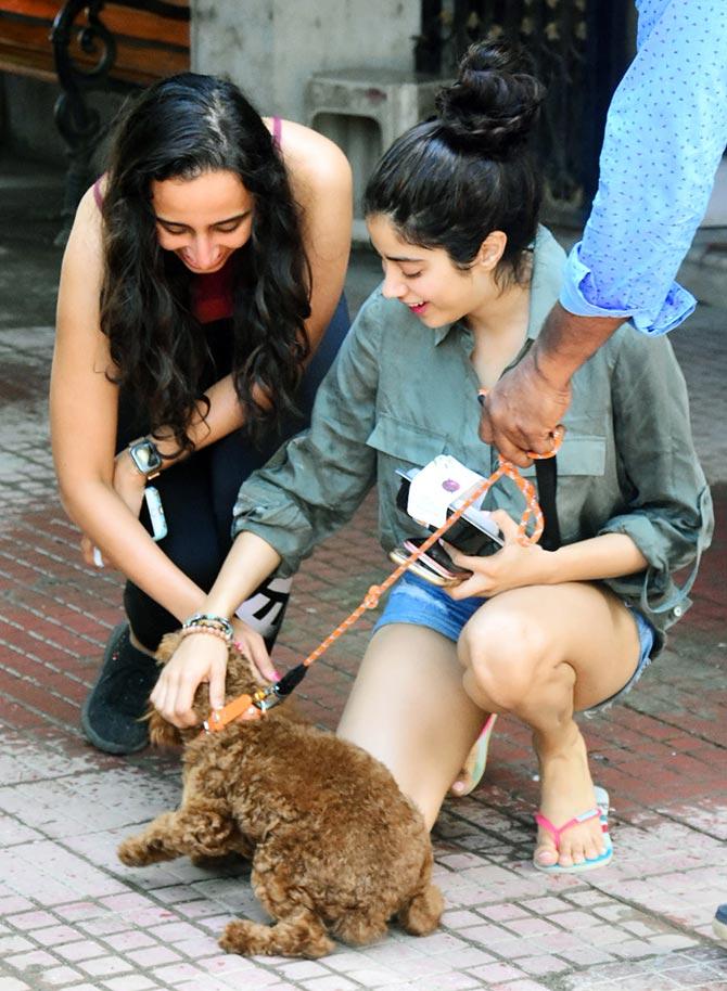 Janhvi Kapoor along with her trainer Namrata Purohit was clicked near their gym in the city. The two girls stopped to play with a pup that they saw in the street. (All pictures/Yogen Shah)