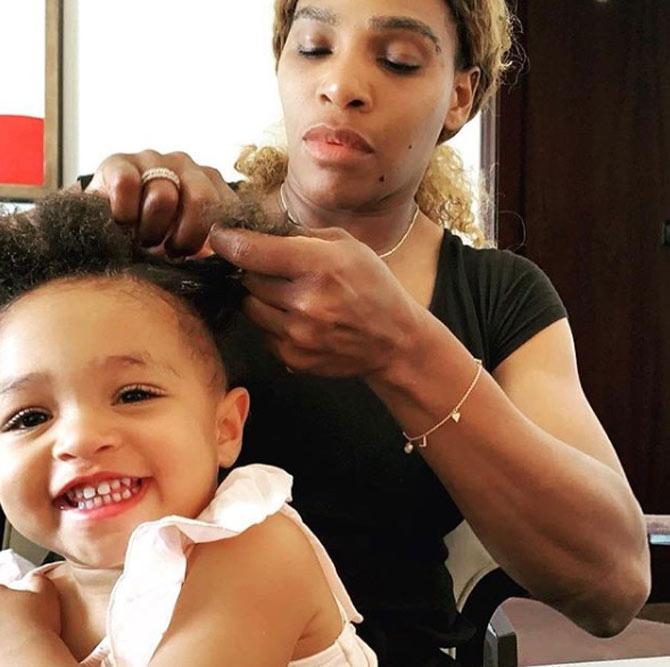 While Serena braids her daughter Olympia's hair, she captioned the photo: Braiding started in Africa with the Himba people of Namibia. We have been braiding our hair for centuries. In many African tribes braided hairstyles were a unique way to identify each tribe. Because of the time it would take people would often take the time to socialize. It began with the elders braiding their children, then the children would watch and learn from them. The tradition of bonding was carried on for generations and quickly made its way across the world. I am honored to share this bonding experience with my own daughter and add another generation of historic traditions. @olympiaohanian