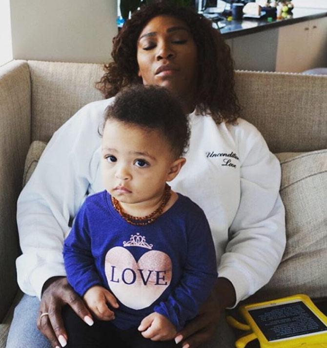 Serena Williams shared a cute photo of her as she dozes off to sleep while her baby is glued to the television. Staying at the @newyorkpalace has been so relaxing. When @olympiaohanian and I were watching jw videos after a long day #thismama passed out. Olympia was clearly not happy but I could not have been more comfortable anywhere else. Thanks so much @newyorkpalace for having me. It’s always a pleasure.