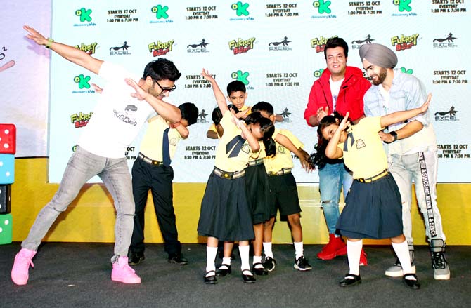 Producer Ritesh Sidhwani, whose production company Excel Entertainment entered into the world of television with an animated show, Fukrey Boyzzz, has said that the show will add value and strength to the Fukrey franchise. All pictures/Yogen Shah
In picture: Pulkit Samrat, Varun Sharma and Manjot Singh with the kids at the Fukrey Boyzzz event.