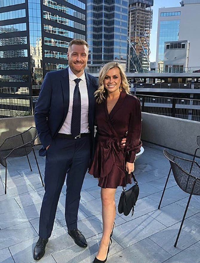 Guptill shared this photo with his wife Laura after attending a wedding and captioned it, 'Had a great time celebrating @ic3_odi and @_angelinavanr on their wedding day. @lauramcgoldrick13 looked smoking hot'