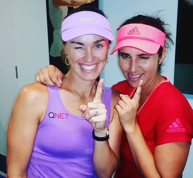 Martina Hingis and Sania Mirza bring out their goofy side in this picture. Hingis captioned it, 'silly faces after our match. off to a good start with @mirzasaniar at the @usopen'