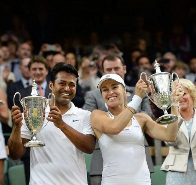 Martina Hingis with her mixed doubles partner and Indian tennis ace Leander Paes after their Wimbledon triumph.