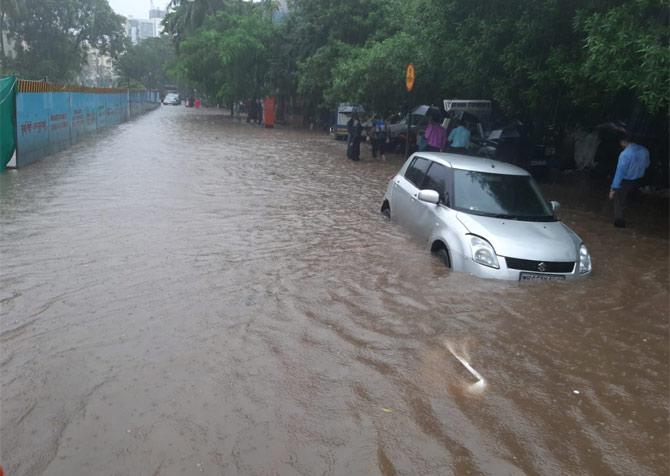 In the picture, a car is submerged in the waterlogged area in Vile Parle
(Picture courtesy/Satej Shinde)