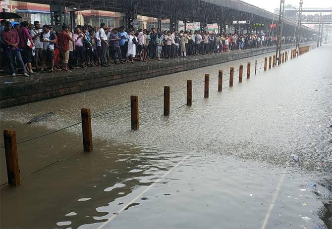 Due to heavy rains in Mumbai, water started to flood railway tracks at Vasai-Virar thus terminating railway services
(Picture courtesy/Rajendra B Aklekar)